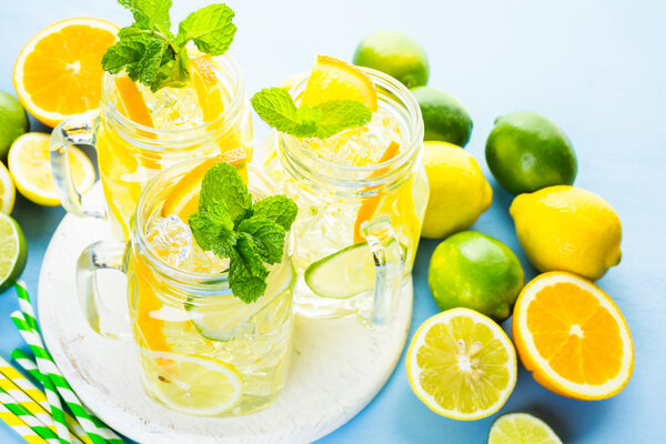 Water with fresh citrus fruits and ice