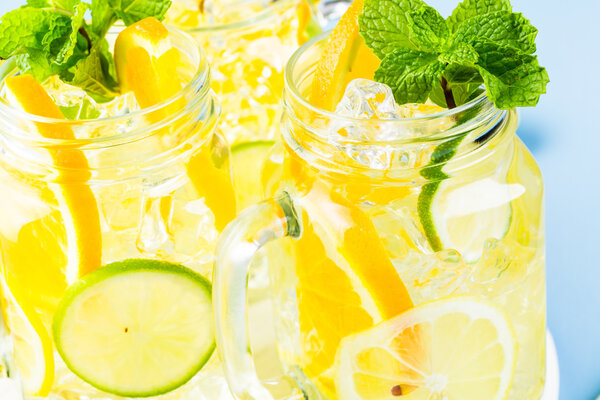 Water with fresh citrus fruits and ice