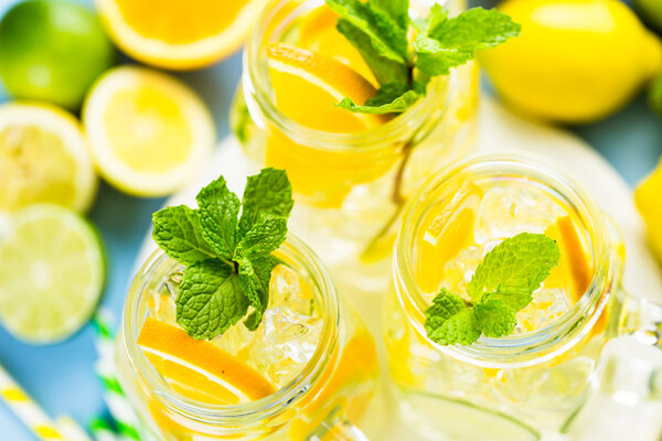 Water with fresh citrus fruits and ice