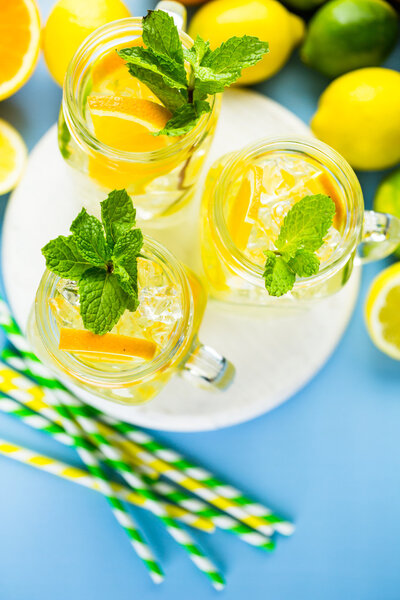 Water with fresh citrus fruits and ice