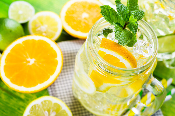 Water with fresh citrus fruits and ice