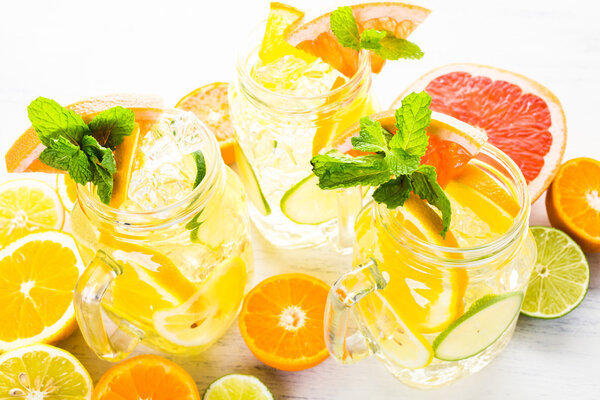 Water with fresh citrus fruits and ice