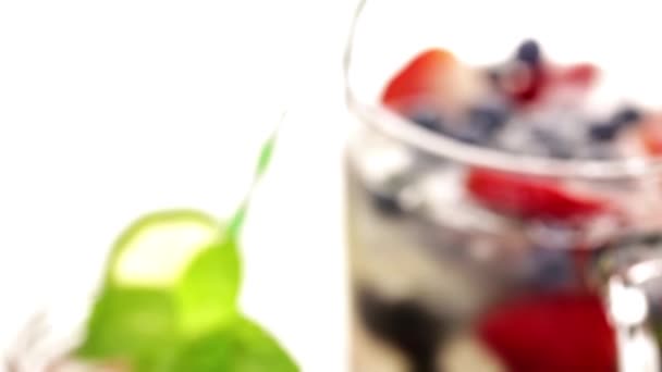 Water made with organic citruses and berries — Stock Video