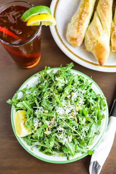 Arugula salad with pine nuts — Stock Photo, Image