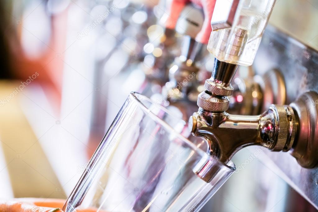 Bartender pouring draft beer