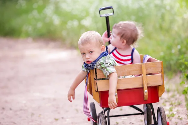 Two cute toddlers in the park — Stock Photo, Image