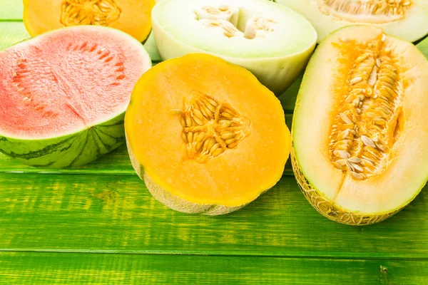 Variety of organic melons sliced — Stockfoto