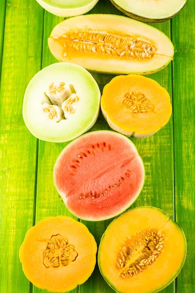 Variety of organic melons sliced — Stockfoto