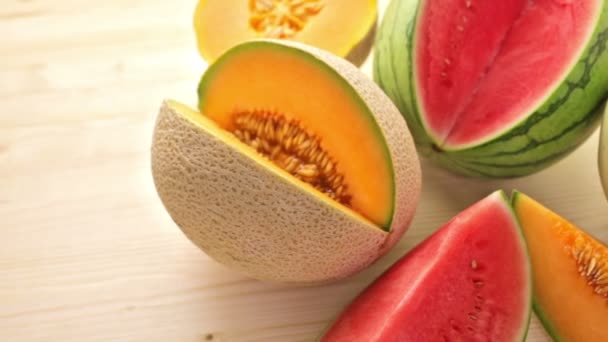 Variety of organic melons sliced — Stock Video