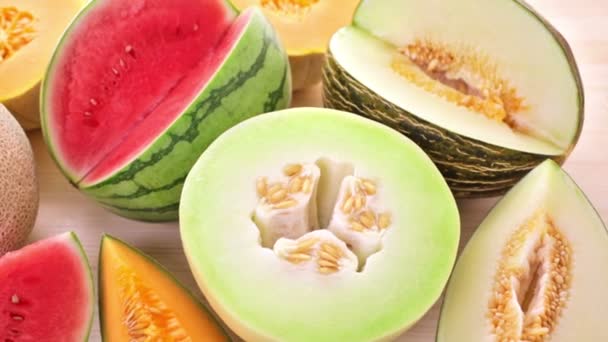 Variety of organic melons sliced — Stock Video