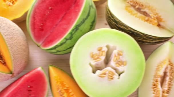 Variety of organic melons sliced — Stock video