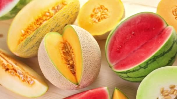 Variety of organic melons sliced — Stock Video