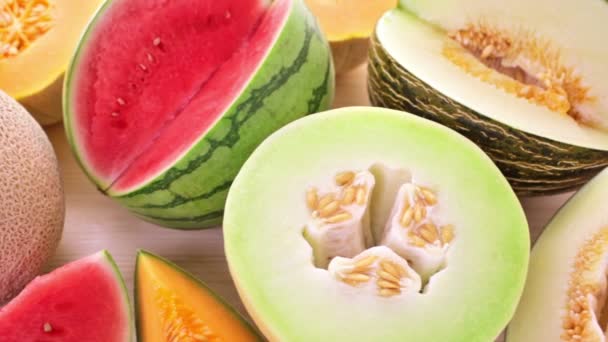 Variety of organic melons sliced — Stock Video