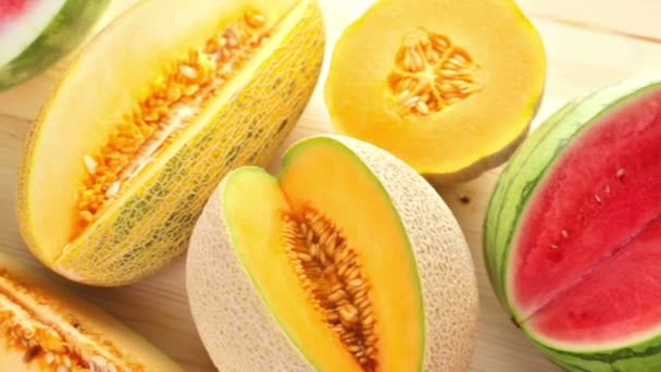 Variety of organic melons sliced — Stock Video