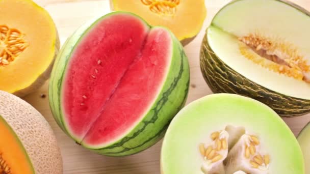 Variety of organic melons sliced — Stock Video