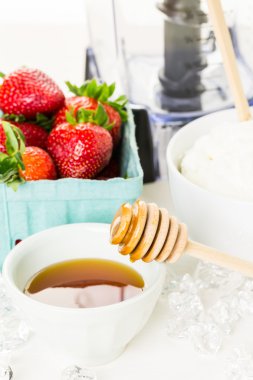 Ingredients for smoothie with plain yogurt and berries