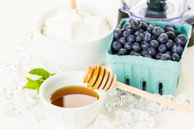 Ingredients for smoothie with plain yogurt and berries