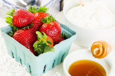 Ingredients for smoothie with plain yogurt and berries