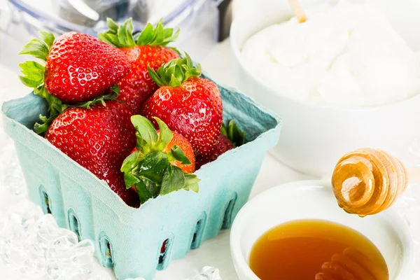 Ingredients for smoothie with plain yogurt and berries