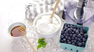 Ingredients for smoothie with plain yogurt and berries