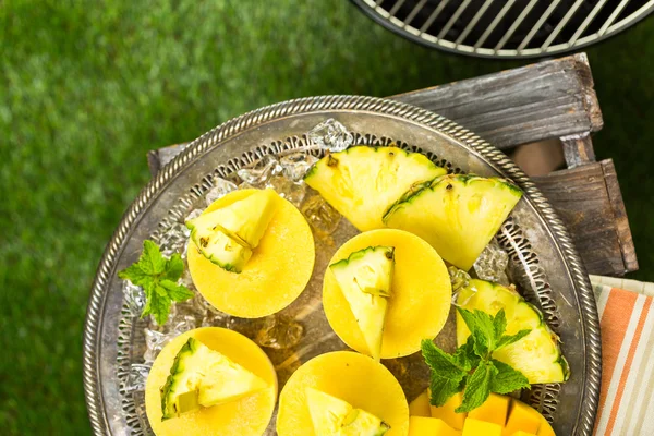 Popsicles made with mango, pineapple and coconut milk — Stock Photo, Image