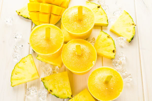Popsicles made with mango, pineapple and coconut milk — Stock Photo, Image