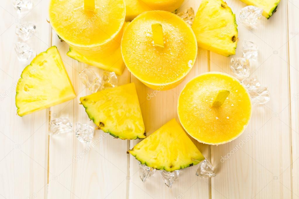 popsicles made with mango, pineapple and coconut milk