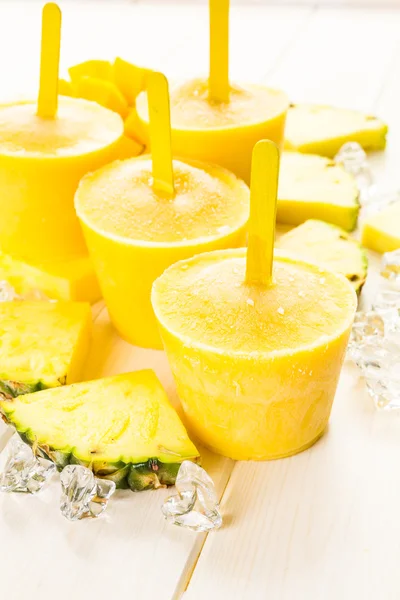 Popsicles made with mango, pineapple and coconut milk. — Stock Photo, Image