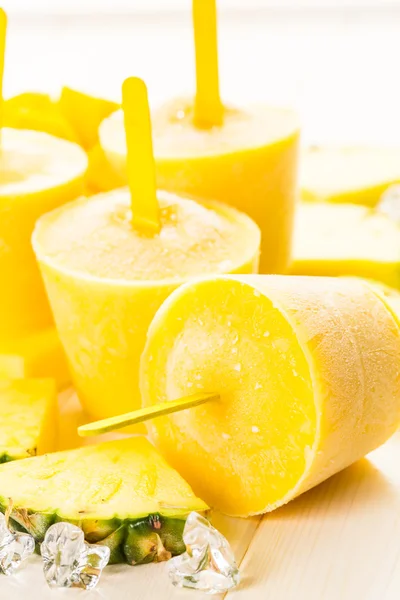 Popsicles made with mango, pineapple and coconut milk — Stock Photo, Image