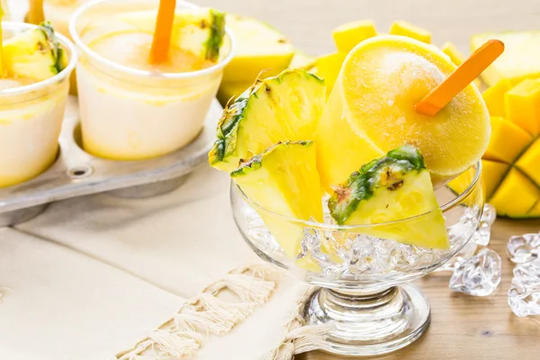 Popsicles made with mango, pineapple and coconut milk — Stock Photo, Image