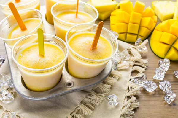 Popsicles made with mango, pineapple and coconut milk — Stock Photo, Image