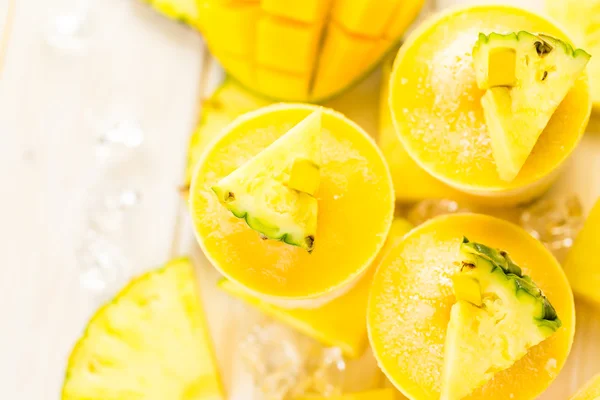 Popsicles made with mango, pineapple and coconut milk — Stock Photo, Image