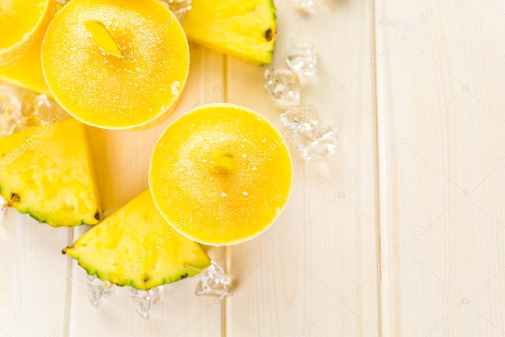 popsicles made with mango, pineapple and coconut milk