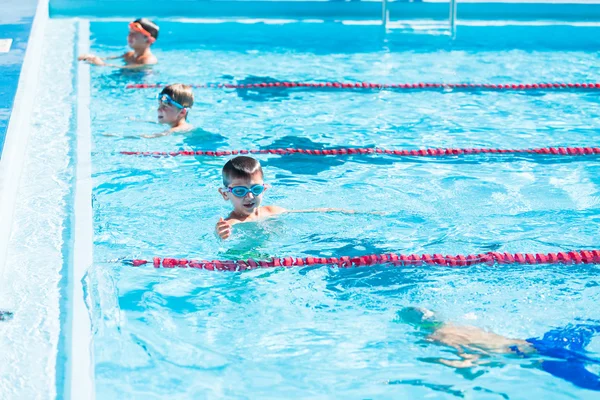 Kids swim meet in outdoor pool — Stock Photo, Image