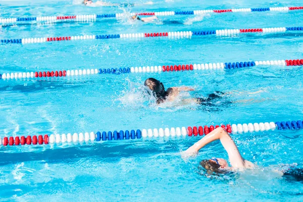 Kids swim meet in outdoor pool — Stock Photo, Image