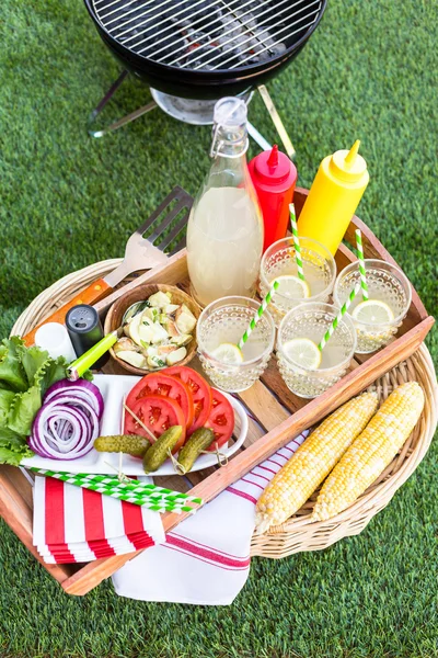 Small summer picnic with lemonade and corn — Stock Photo, Image