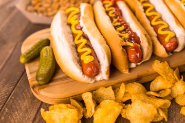Grilled hot dogs with mustard and ketchup clipart
