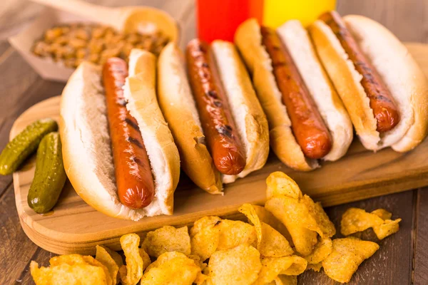 Grilled hot dogs on a white hot dog buns