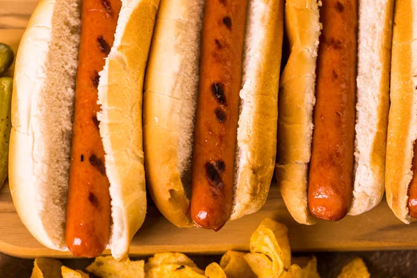 Grilled hot dogs on a white hot dog buns — Stock Photo, Image