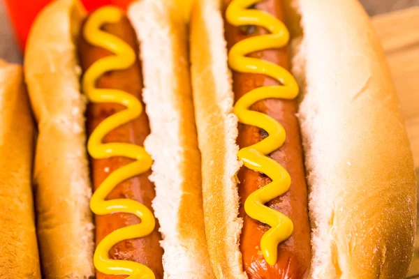 Grilled hot dogs with mustard and ketchup — Stock Photo, Image