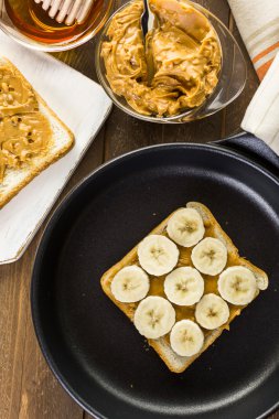 Homemade peanut butter and banana sandwich clipart