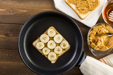Homemade peanut butter and banana sandwich clipart