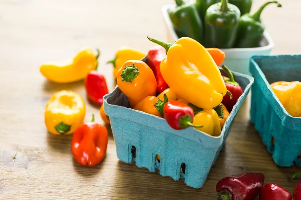 Organic Peppers on table — Stock Photo, Image