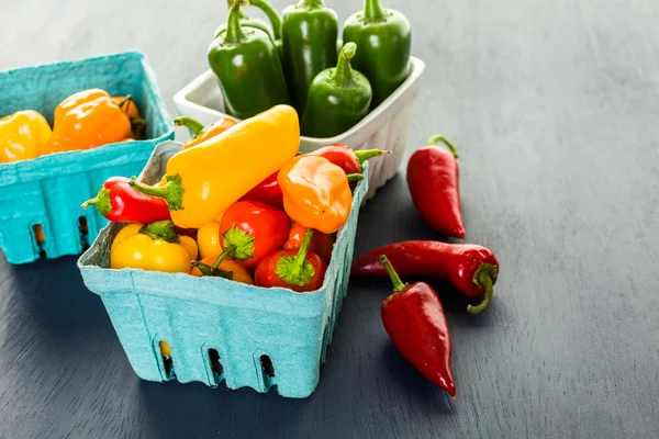 Organic Peppers on table — Stock Photo, Image