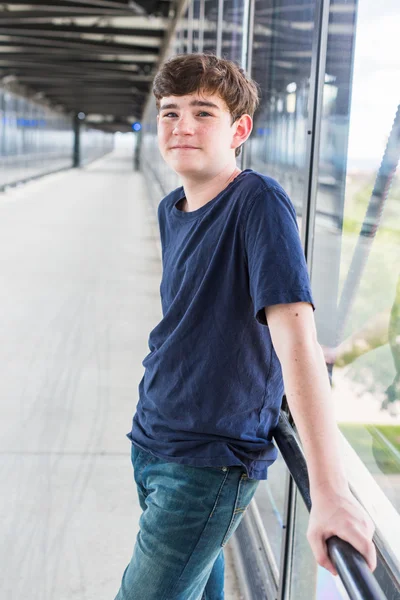 Teenage boy at the light rail station — Stock Photo, Image