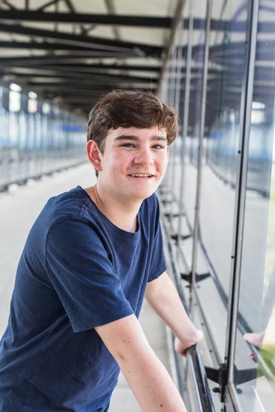 Teenage boy at the light rail station — Stock Photo, Image