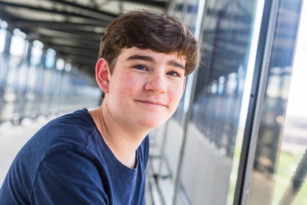 Teenage boy at the light rail station — Stock Photo, Image