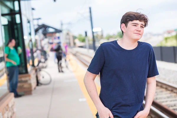 Teenage boy at the light rail station — Stock Photo, Image