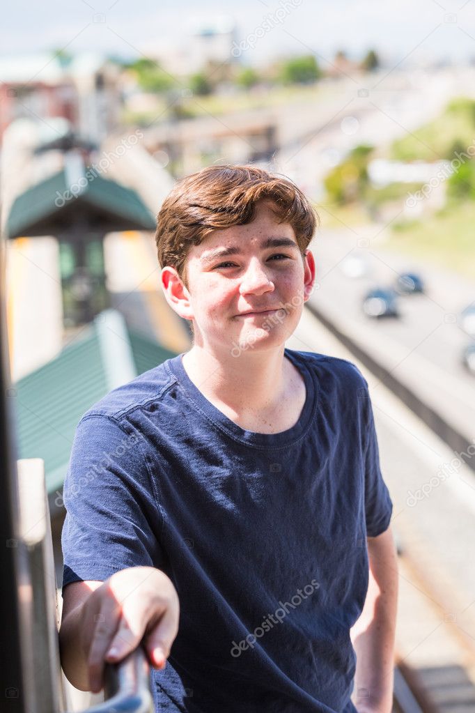 Teenage boy at the light rail station