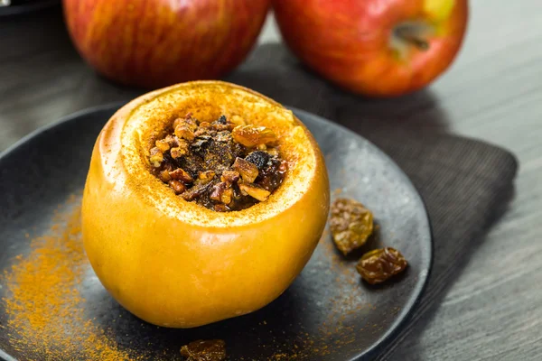 Baked apples with pecans and raisins — Stock Photo, Image